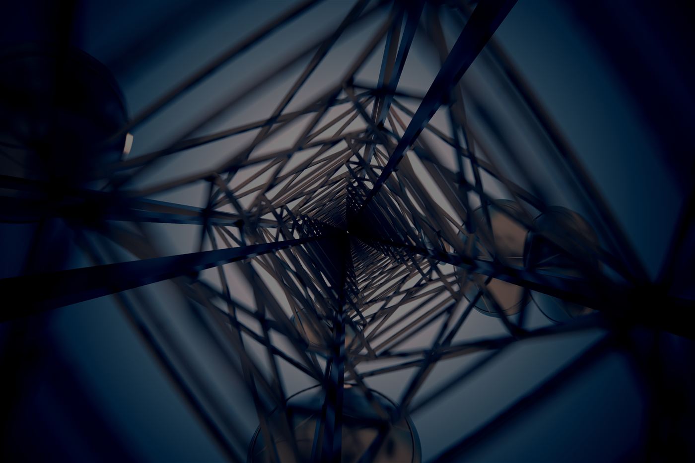 Looking up through the steel lattice of a communications tower